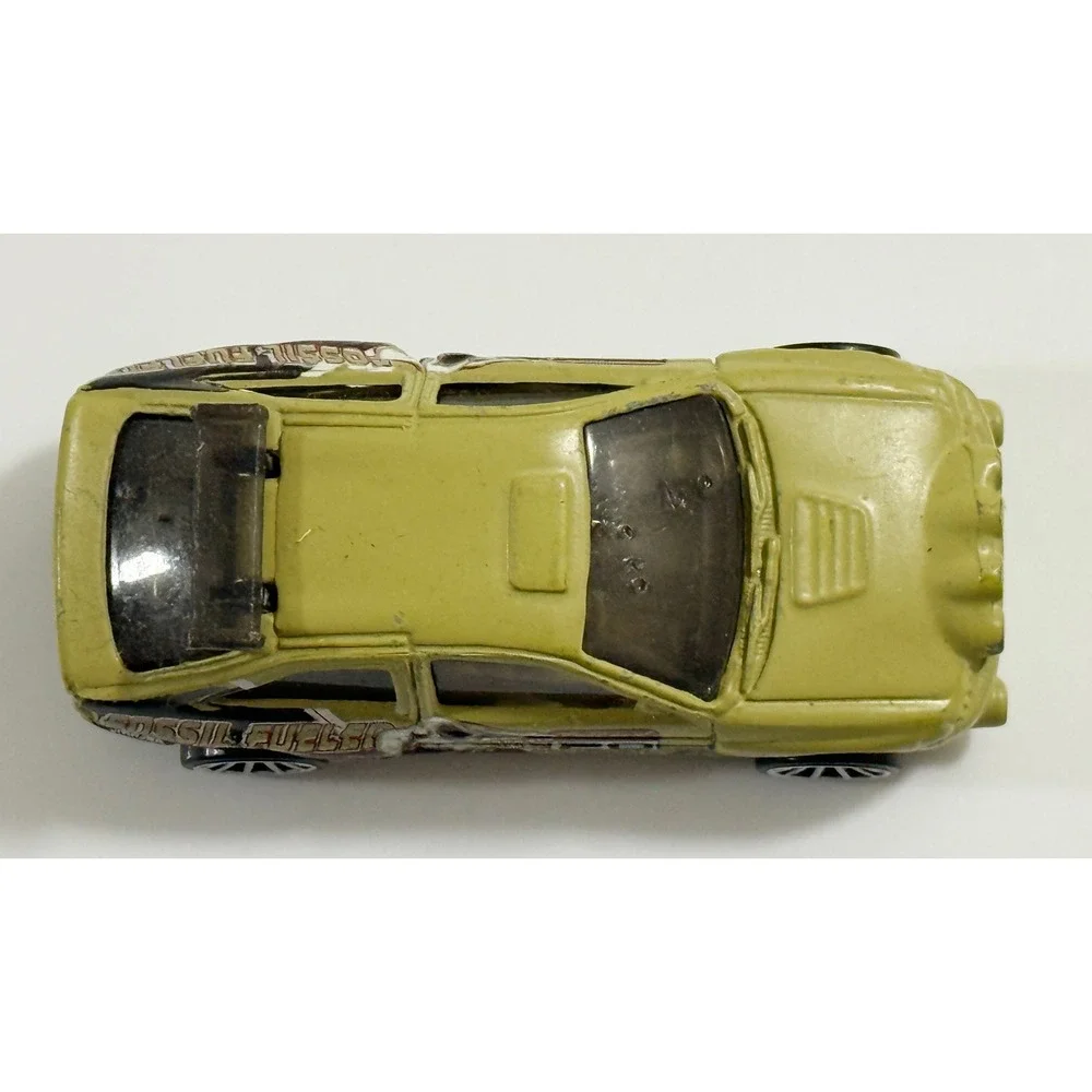 Hot Wheels Escort Rally Kids 1/64 Tan Fossil Fueled T-Rex Dinosaur Car 1996
